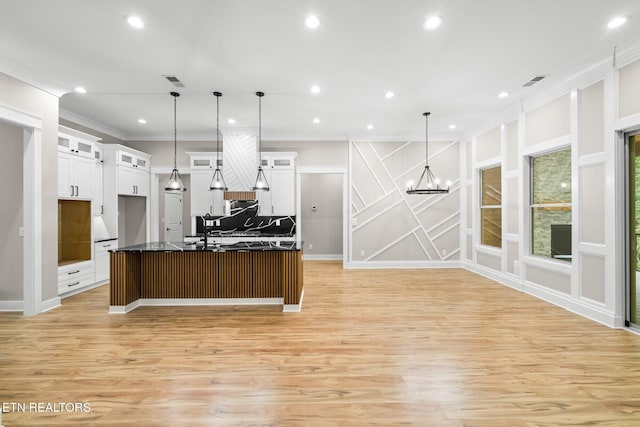 104 Noya Ln, Loudon, TN 37774 - kitchen featuring crown molding, light wood-style flooring, a chandelier, white cabinets, and dark countertops
