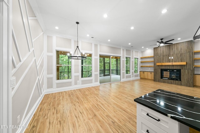 104 Noya Ln, Loudon, TN 37774 - kitchen with a large fireplace, light wood finished floors, a chandelier, recessed lighting, and crown molding