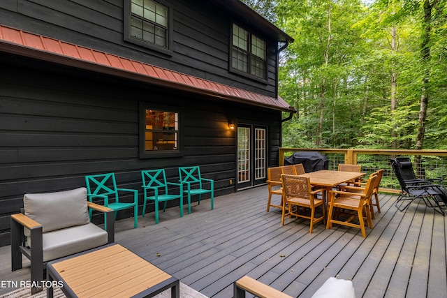 391 Laurel Rd, Townsend, TN 37882 - wooden terrace with outdoor dining space and area for grilling