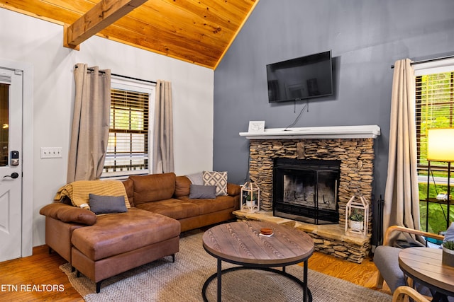 391 Laurel Rd, Townsend, TN 37882 - living room featuring vaulted ceiling, wood finished floors, wood ceiling, plenty of natural light, and a stone fireplace