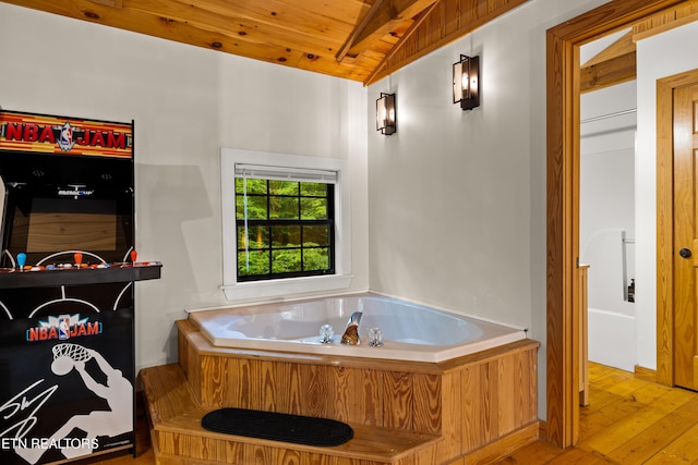 391 Laurel Rd, Townsend, TN 37882 - bathroom with wood ceiling, hardwood / wood-style floors, and a bath