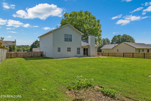 1720 Chesapeake Dr, Athens, TN 37303 - back of property with a chimney, central air condition unit, and a patio