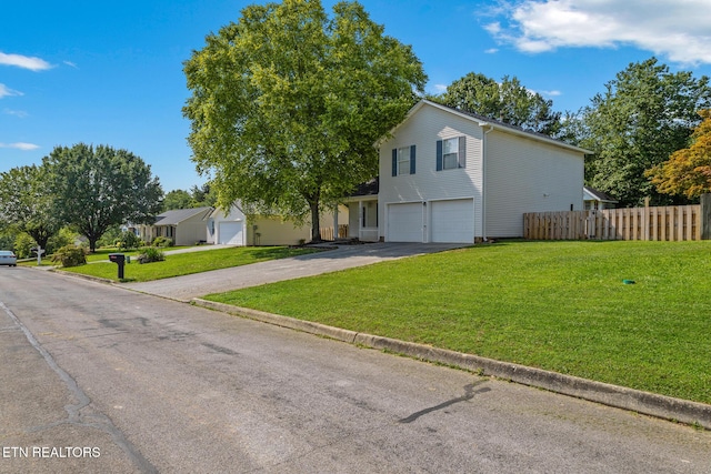 1720 Chesapeake Dr, Athens, TN 37303 - view of front facade with a garage and asphalt driveway