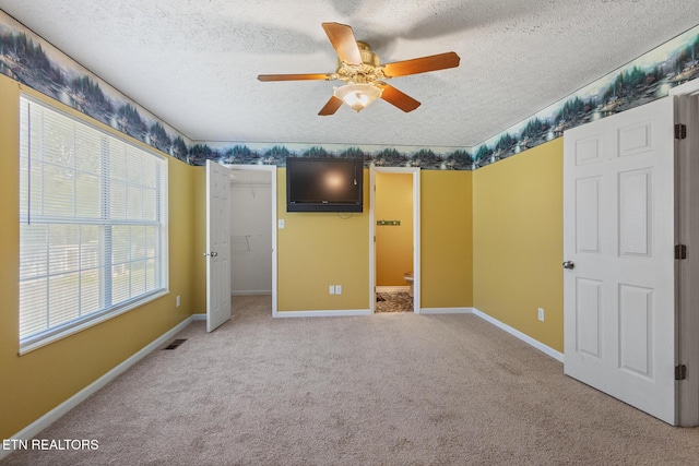 1720 Chesapeake Dr, Athens, TN 37303 - unfurnished bedroom featuring a textured ceiling, carpet, baseboards, ceiling fan, and ensuite bathroom