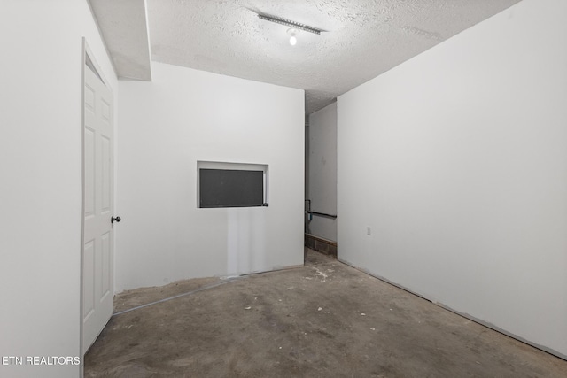 1720 Chesapeake Dr, Athens, TN 37303 - empty room featuring concrete floors and a textured ceiling