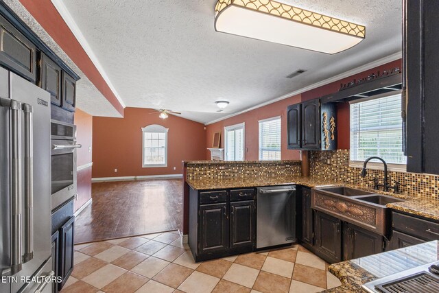 1720 Chesapeake Dr, Athens, TN 37303 - kitchen with stainless steel appliances, a textured ceiling, a sink, a ceiling fan, and dark stone counters