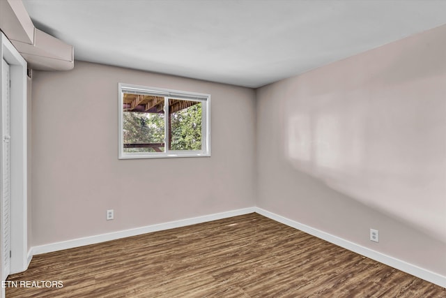 9209 Topoco Dr, Knoxville, TN 37922 - spare room featuring dark wood-style floors and baseboards