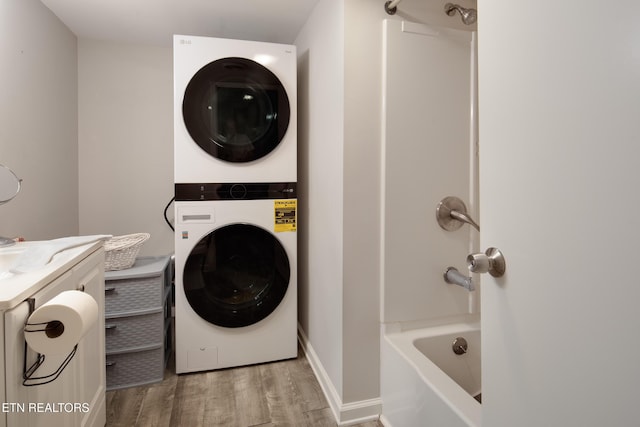 193 Laurel Hollow Rd, Clinton, TN 37716 - laundry room featuring stacked washing machine and dryer and light wood-style floors