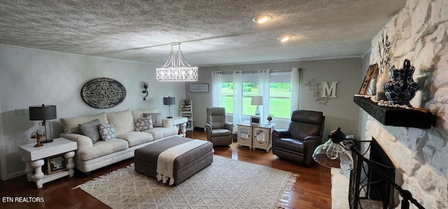 1922 Chaney Ridge Rd, London, KY 40741 - living area featuring wood finished floors, a chandelier, a textured ceiling, and ornamental molding