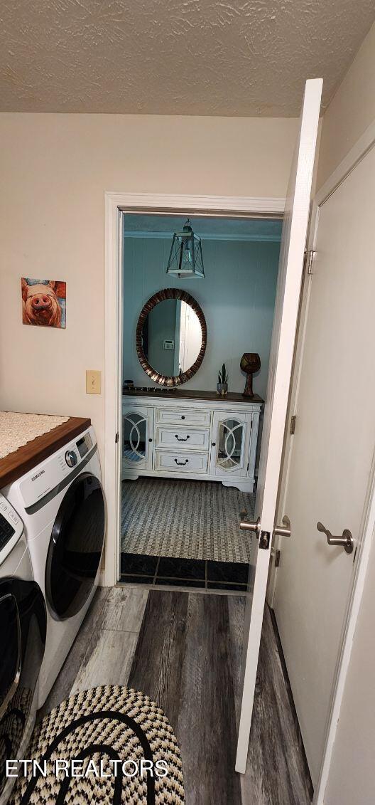 1922 Chaney Ridge Rd, London, KY 40741 - washroom with separate washer and dryer, wood finished floors, and a textured ceiling