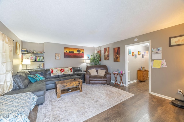 902 Rosedale Ave, Loudon, TN 37774 - living room featuring dark wood-style flooring, baseboards, and a textured ceiling