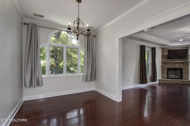 430 Willow Springs Dr, Athens, TN 37303 - unfurnished living room featuring a chandelier, wood-type flooring, baseboards, a stone fireplace, and ornamental molding