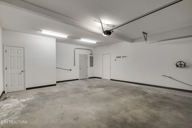 430 Willow Springs Dr, Athens, TN 37303 - garage featuring electric panel, a garage door opener, and baseboards