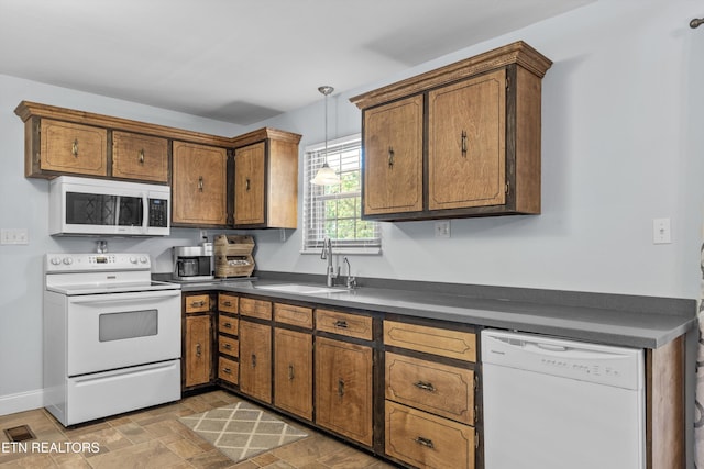 1670 Bowen Rd, Rutledge, TN 37861 - kitchen with white appliances, a sink, dark countertops, brown cabinetry, and hanging light fixtures