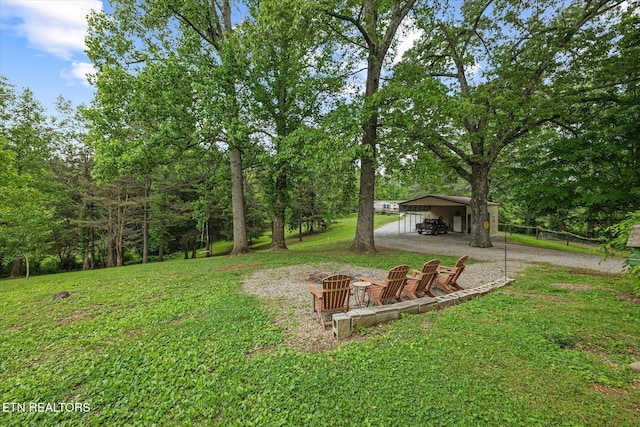 2059 Bolestown Loop, Alpine, TN 38543 - view of yard featuring dirt driveway and an outdoor fire pit