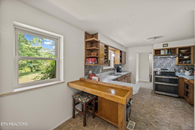 2059 Bolestown Loop, Alpine, TN 38543 - kitchen with open shelves, range with two ovens, under cabinet range hood, and backsplash