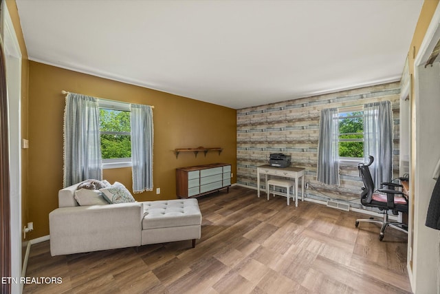 2059 Bolestown Loop, Alpine, TN 38543 - living room featuring an accent wall, baseboards, and an office area