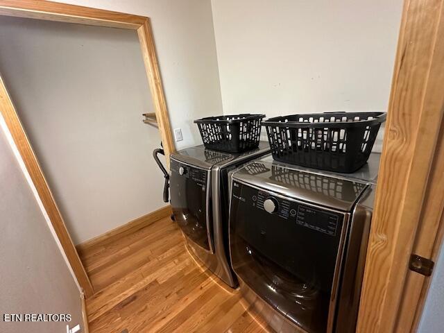 1015 Kizzy Patch Way, Del Rio, TN 37727 - laundry room featuring washing machine and clothes dryer and wood finished floors