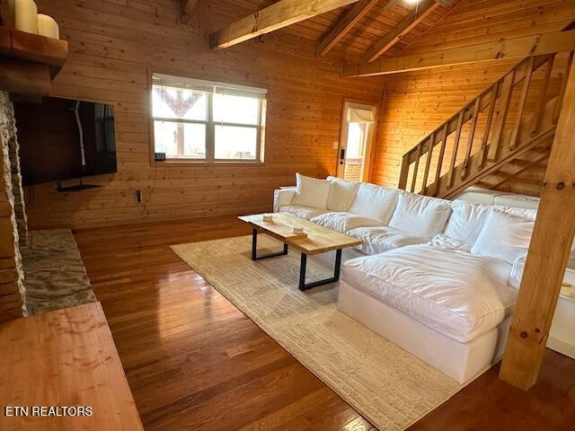 1015 Kizzy Patch Way, Del Rio, TN 37727 - living area with wood ceiling, wood walls, wood finished floors, and stairway