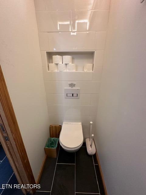 1015 Kizzy Patch Way, Del Rio, TN 37727 - bathroom with tile patterned floors, toilet, and baseboards