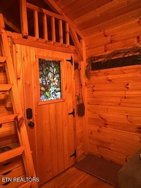 533 Valley Ridge Rd, Jamestown, TN 38556 - doorway to outside featuring wooden walls, wooden ceiling, and wood finished floors