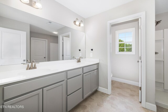 8104 Equinox Ln, Powell, TN 37849 - full bath with double vanity, toilet, and baseboards