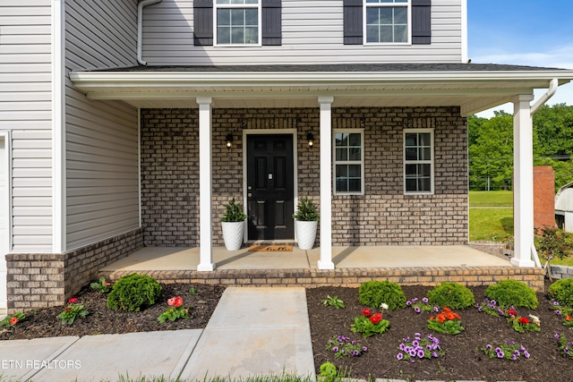 8104 Equinox Ln, Powell, TN 37849 - entrance to property with covered porch and brick siding