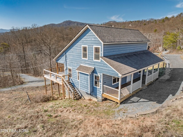 1108 Circle Pt, Gatlinburg, TN 37738 - back of property featuring roof with shingles, stairs, a porch, and a deck with mountain view
