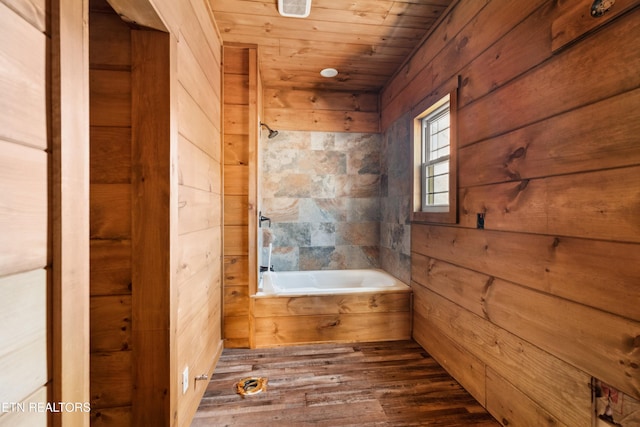 1108 Circle Pt, Gatlinburg, TN 37738 - full bath featuring wood finished floors, a bath, wood walls, and wooden ceiling