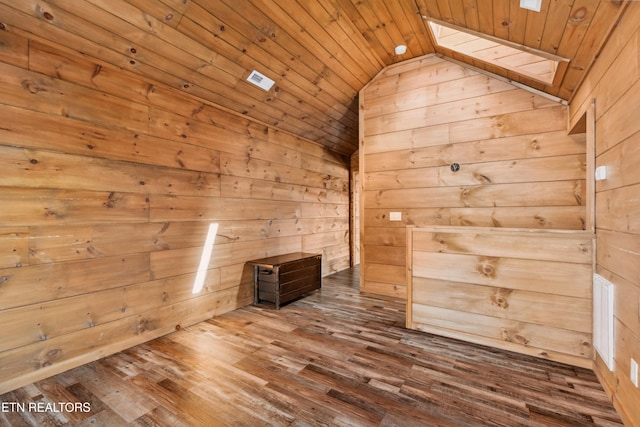 1108 Circle Pt, Gatlinburg, TN 37738 - empty room with wooden ceiling, lofted ceiling, wood walls, a skylight, and wood finished floors