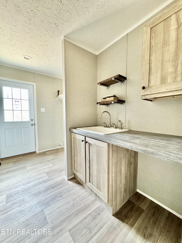 320 Perkey Way, Tazewell, TN 37879 - kitchen featuring a sink, a textured ceiling, light wood-style flooring, light brown cabinetry, and open shelves