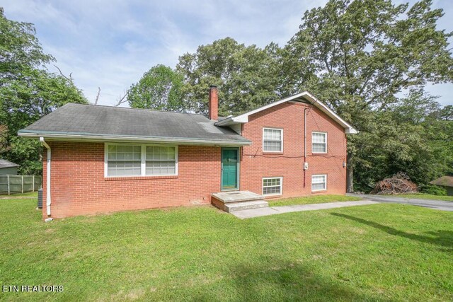 2001 Highland Rd, Maryville, TN 37801 - split level home featuring brick siding, a chimney, and a shingled roof