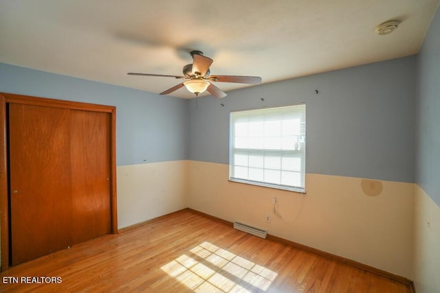 2001 Highland Rd, Maryville, TN 37801 - unfurnished bedroom with light wood-style floors, a closet, baseboards, and a ceiling fan