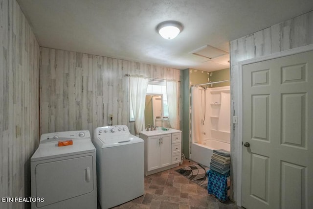 2001 Highland Rd, Maryville, TN 37801 - washroom with washer and dryer, wood walls, attic access, and stone finish flooring
