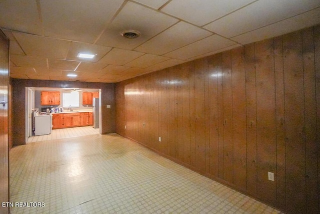 2001 Highland Rd, Maryville, TN 37801 - basement featuring a sink, wood walls, and a paneled ceiling