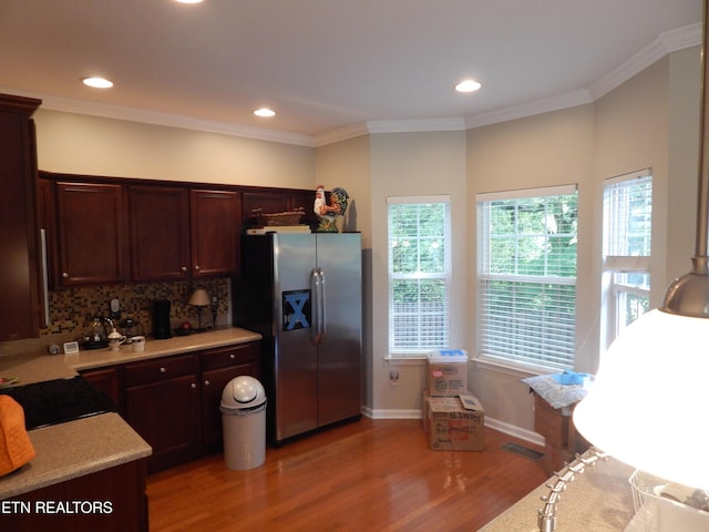 9100 Sway Branch Ln, Knoxville, TN 37922 - kitchen featuring stainless steel fridge with ice dispenser, light wood-type flooring, light countertops, backsplash, and recessed lighting