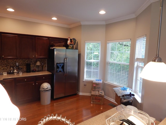 9100 Sway Branch Ln, Knoxville, TN 37922 - kitchen featuring stainless steel refrigerator with ice dispenser, light wood finished floors, light countertops, decorative backsplash, and recessed lighting