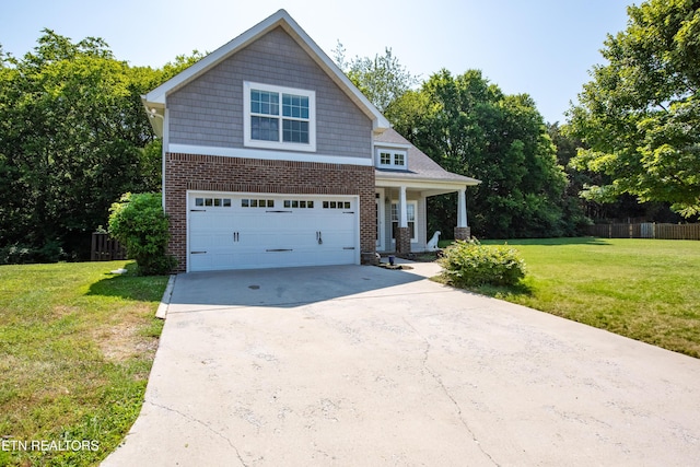 9100 Sway Branch Ln, Knoxville, TN 37922 - craftsman inspired home with driveway, brick siding, a garage, and covered porch