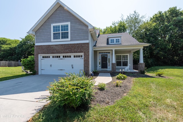 9100 Sway Branch Ln, Knoxville, TN 37922 - craftsman-style home featuring a porch, concrete driveway, brick siding, and an attached garage