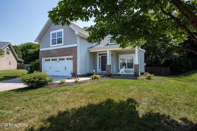 9100 Sway Branch Ln, Knoxville, TN 37922 - craftsman house featuring an attached garage, covered porch, driveway, and brick siding