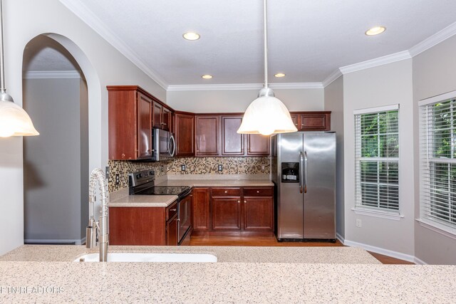 9100 Sway Branch Ln, Knoxville, TN 37922 - kitchen featuring stainless steel appliances, backsplash, light countertops, recessed lighting, and hanging light fixtures