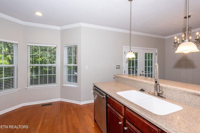 9100 Sway Branch Ln, Knoxville, TN 37922 - kitchen featuring stainless steel dishwasher, light wood-style flooring, decorative light fixtures, ornamental molding, and a chandelier