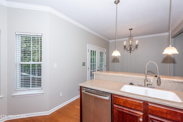9100 Sway Branch Ln, Knoxville, TN 37922 - kitchen featuring dishwasher, light wood finished floors, light countertops, ornamental molding, and a chandelier
