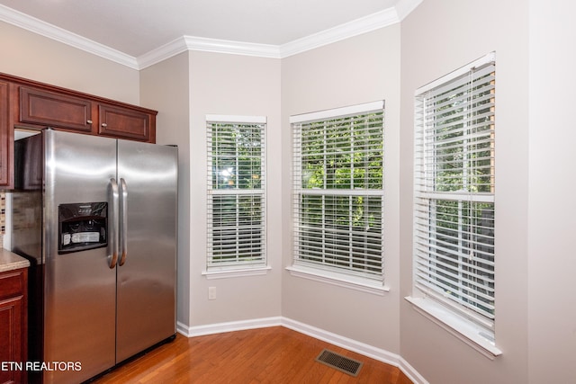 9100 Sway Branch Ln, Knoxville, TN 37922 - kitchen featuring stainless steel refrigerator with ice dispenser, wood finished floors, ornamental molding, and light countertops