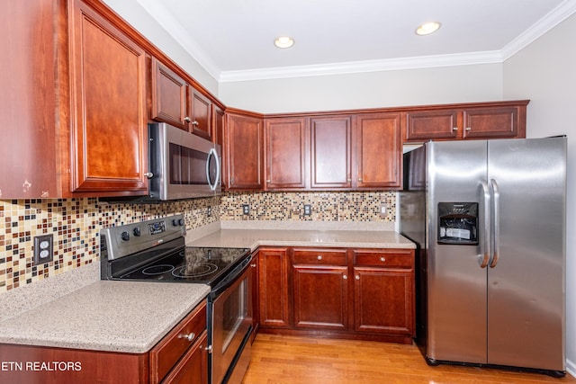 9100 Sway Branch Ln, Knoxville, TN 37922 - kitchen featuring appliances with stainless steel finishes, crown molding, light wood-style floors, backsplash, and recessed lighting