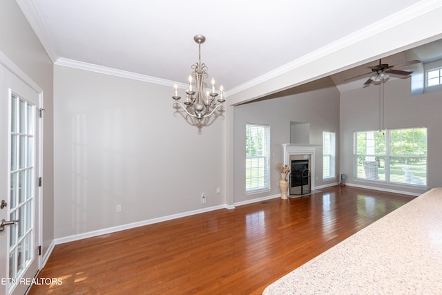 9100 Sway Branch Ln, Knoxville, TN 37922 - unfurnished living room with wood finished floors, a chandelier, crown molding, a ceiling fan, and a premium fireplace