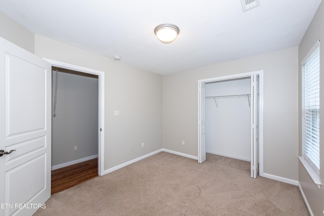 9100 Sway Branch Ln, Knoxville, TN 37922 - unfurnished bedroom with light colored carpet and a closet