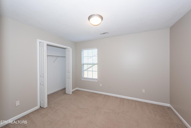 9100 Sway Branch Ln, Knoxville, TN 37922 - unfurnished bedroom with light colored carpet and a closet