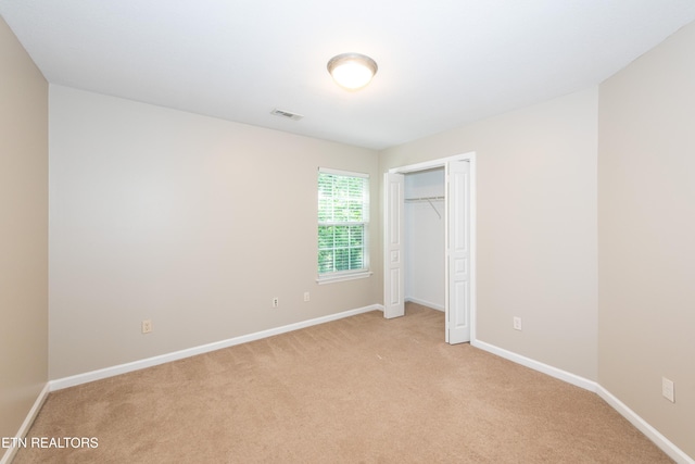 9100 Sway Branch Ln, Knoxville, TN 37922 - unfurnished bedroom with light colored carpet and a closet