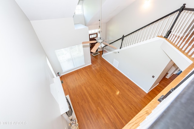 9100 Sway Branch Ln, Knoxville, TN 37922 - staircase featuring a towering ceiling, ceiling fan, and wood finished floors